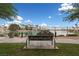 Relaxing community space with a bench overlooking a tranquil lake surrounded by well-kept homes and landscaping at 10021 Skipper Ct, Las Vegas, NV 89117