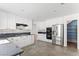 Bright kitchen features stainless steel appliances, white cabinets, and stone countertops at 10021 Skipper Ct, Las Vegas, NV 89117
