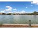 Picturesque lake view with waterfront homes, offering a serene and tranquil community setting at 10021 Skipper Ct, Las Vegas, NV 89117