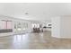 Open-concept living space with French doors and kitchen access at 10021 Skipper Ct, Las Vegas, NV 89117