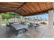 Shaded picnic area with tables and a view of the lake, ideal for community gatherings and outdoor dining at 10021 Skipper Ct, Las Vegas, NV 89117