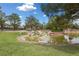 Scenic community pond featuring a rock waterfall and lush green landscaping in a well-maintained neighborhood at 10021 Skipper Ct, Las Vegas, NV 89117