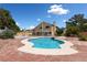 Sparkling backyard pool and spa, surrounded by brick pavers and lush greenery, ideal for outdoor enjoyment at 10021 Skipper Ct, Las Vegas, NV 89117