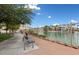 Picturesque walkway along the lake, offering serene views of waterfront homes, landscaping, and community amenities at 10021 Skipper Ct, Las Vegas, NV 89117