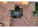 Detailed aerial view of the home's tile roof, landscaped courtyard, and outdoor sitting area at 15 Rue Du Rivoli Pl, Henderson, NV 89011