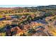 Elevated view displaying a collection of homes, a golf course, and a landscape of arid vegetation at 15 Rue Du Rivoli Pl, Henderson, NV 89011