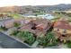 Beautiful aerial view of the home, neighborhood, golf course, mountains and lake in the background at 15 Rue Du Rivoli Pl, Henderson, NV 89011