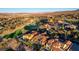 Stunning aerial view of a luxury home overlooking a lush golf course and scenic mountain range at 15 Rue Du Rivoli Pl, Henderson, NV 89011