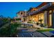 Expansive backyard with a pool, spa, outdoor kitchen, and seating areas for luxury outdoor living at 15 Rue Du Rivoli Pl, Henderson, NV 89011