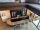 Stunning wet bar with granite counters, display cabinets, wine fridge, and seating for four at 15 Rue Du Rivoli Pl, Henderson, NV 89011