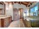 Bathroom featuring wood beams, a stained glass window, a soaking tub, and a classic vanity at 15 Rue Du Rivoli Pl, Henderson, NV 89011