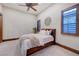 Comfortable bedroom with natural light, neutral décor and a ceiling fan to provide added comfort at 15 Rue Du Rivoli Pl, Henderson, NV 89011