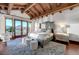 A well-lit main bedroom, featuring mountain views and a seating area at 15 Rue Du Rivoli Pl, Henderson, NV 89011