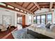 Bedroom with wood-beamed ceilings, mountain views, and a luxurious, bright ambiance at 15 Rue Du Rivoli Pl, Henderson, NV 89011
