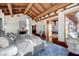 Bedroom featuring beamed ceilings, hardwood floors, and a cozy seating area at 15 Rue Du Rivoli Pl, Henderson, NV 89011