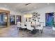 Elegant dining room with stone floors, modern lighting, and a large table, ideal for gatherings at 15 Rue Du Rivoli Pl, Henderson, NV 89011