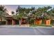 Charming home featuring a terracotta roof, mature trees, and a well-manicured front yard at 15 Rue Du Rivoli Pl, Henderson, NV 89011
