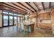 Gourmet kitchen with exposed beams, oversized island with seating, high end appliances, and mountain views at 15 Rue Du Rivoli Pl, Henderson, NV 89011