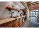 Gourmet kitchen area featuring wooden cabinets and shelves, and luxury finishes at 15 Rue Du Rivoli Pl, Henderson, NV 89011