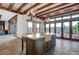 Stylish kitchen with an island, breakfast bar, stone floors, and views to the backyard and mountains at 15 Rue Du Rivoli Pl, Henderson, NV 89011