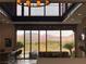 Spacious living room with large windows offering panoramic mountain views and a bar with barstool seating at 15 Rue Du Rivoli Pl, Henderson, NV 89011