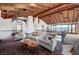 Upstairs living room featuring a beamed ceiling, comfortable seating and an outside view at 15 Rue Du Rivoli Pl, Henderson, NV 89011