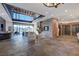 Spacious living room with high ceilings, stone fireplace, bar area, and stunning mountain views at 15 Rue Du Rivoli Pl, Henderson, NV 89011