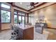 Bright office featuring wood beams, desk with drawers, area rug, and beautiful backyard views at 15 Rue Du Rivoli Pl, Henderson, NV 89011