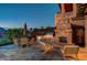 Outdoor kitchen with a built-in grill, fireplace, and dining area, ideal for gatherings at 15 Rue Du Rivoli Pl, Henderson, NV 89011