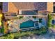 Inviting pool and spa with a stone deck surrounded by lush landscaping to enhance your backyard experience at 15 Rue Du Rivoli Pl, Henderson, NV 89011