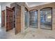 Custom wine cellar with wrought iron doors and stone accents at 15 Rue Du Rivoli Pl, Henderson, NV 89011