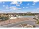 Aerial view overlooking the lake and surrounding cityscape on a sunny day at 16 Heron Harbour Dr, Henderson, NV 89011