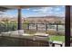 Inviting outdoor balcony with comfortable seating and scenic views of the lake and mountains at 16 Heron Harbour Dr, Henderson, NV 89011