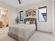 Neutral bedroom featuring modern decor and a doorway view of an ensuite bathroom at 16 Heron Harbour Dr, Henderson, NV 89011