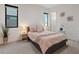Cozy bedroom with a comfy bed, neutral decor, and natural light from the windows at 16 Heron Harbour Dr, Henderson, NV 89011