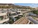 Scenic community view with modern homes featuring outdoor living spaces and spiral staircases at 16 Heron Harbour Dr, Henderson, NV 89011