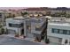 Stunning modern home with unique architecture and beautiful views of the water and mountains in the background at 16 Heron Harbour Dr, Henderson, NV 89011
