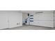 Spacious two car garage with white walls and door with windows for natural light at 16 Heron Harbour Dr, Henderson, NV 89011