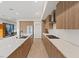 Bright, modern kitchen featuring an island with seating and sleek cabinetry offering ample storage space at 16 Heron Harbour Dr, Henderson, NV 89011