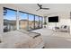 Comfortable main bedroom with scenic lake views from the floor-to-ceiling sliding glass doors at 16 Heron Harbour Dr, Henderson, NV 89011