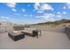 Comfortable rooftop patio with outdoor seating and fire pit overlooking scenic views at 16 Heron Harbour Dr, Henderson, NV 89011