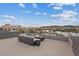 Rooftop patio featuring a fire pit and scenic lake views at 16 Heron Harbour Dr, Henderson, NV 89011