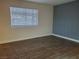 Bedroom with tile flooring, baseboards, and window with white horizontal blinds at 3168 S Eastern Ave # 45, Las Vegas, NV 89169