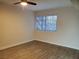 Spacious bedroom featuring tile floors, a ceiling fan, and natural lighting at 3168 S Eastern Ave # 45, Las Vegas, NV 89169