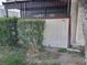 Exterior view of unit 45 with green bushes, plants, grass and a small tree at 3168 S Eastern Ave # 45, Las Vegas, NV 89169