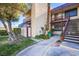 Condo exterior featuring a stairway, balcony, and well-maintained landscaping at 3168 S Eastern Ave # 45, Las Vegas, NV 89169