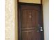 Metal security screen door with door number 45 and doorbell on a light beige stucco building at 3168 S Eastern Ave # 45, Las Vegas, NV 89169