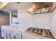 Close up of the kitchen area including stainless steel oven range and exhaust fan at 3168 S Eastern Ave # 45, Las Vegas, NV 89169