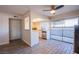 Bright kitchen featuring a ceiling fan, tile flooring, and sliding glass doors to outdoor patio at 3168 S Eastern Ave # 45, Las Vegas, NV 89169