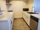 Stylish kitchen featuring modern appliances, tiled countertops, and ample cabinet space at 3168 S Eastern Ave # 45, Las Vegas, NV 89169
